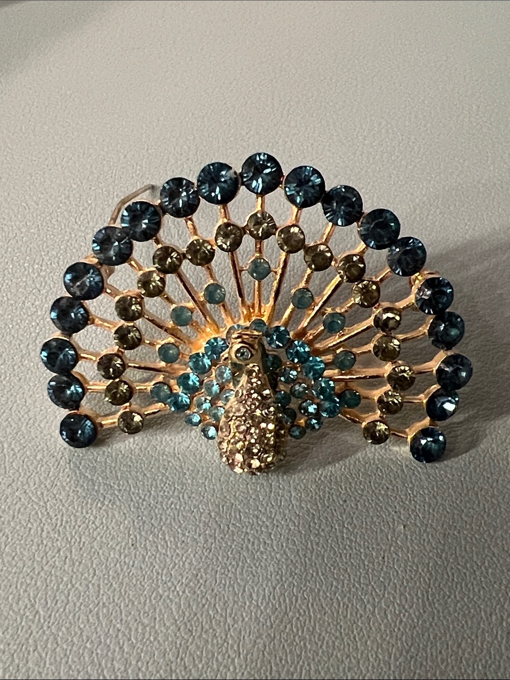 Napier Gold-Tone Peacock Brooch with Blue and Aqua Rhinestones